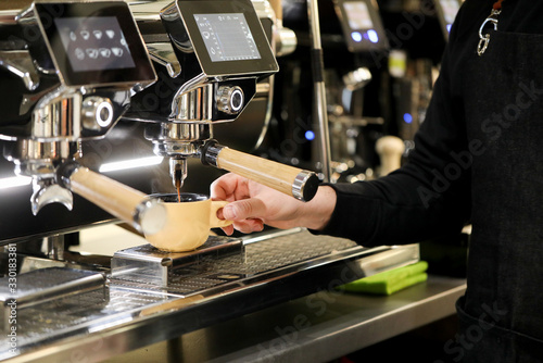 detail of espresso machine making coffee