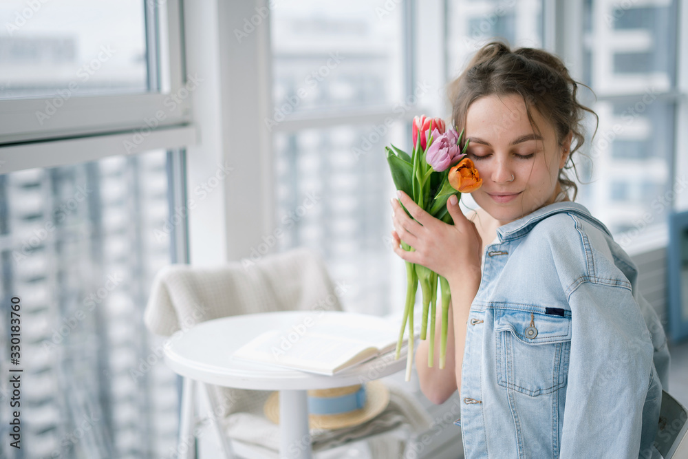 girl at the table with tulips girl at the table with tulips