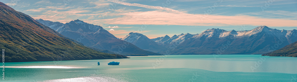 Panoramic view over sunset in Lago Argentino, near Perito Moreno glacier in Patagonia, South America, sunny day, blue sky