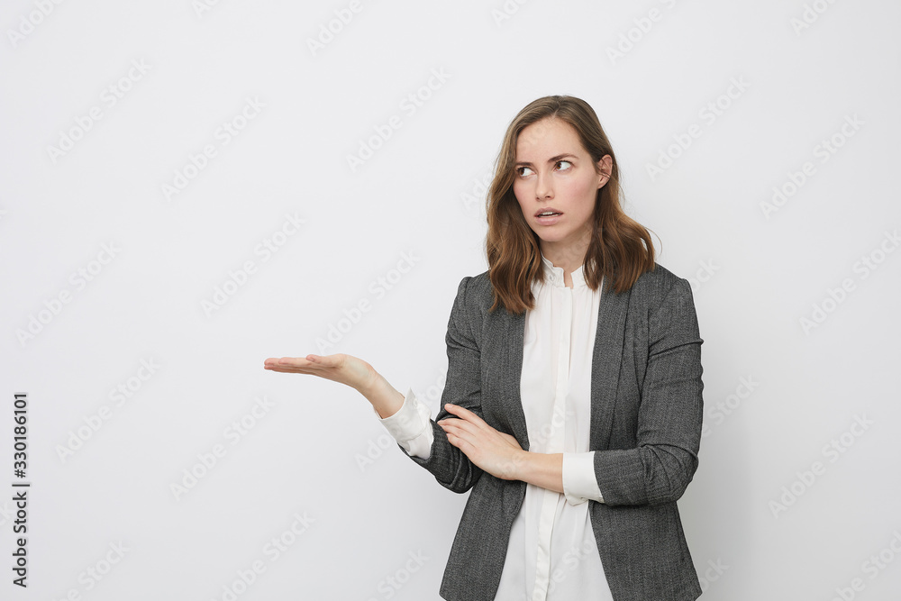 Businesswoman is holding her palm up presenting a problem Businesswoman is holding her palm up presenting a problem