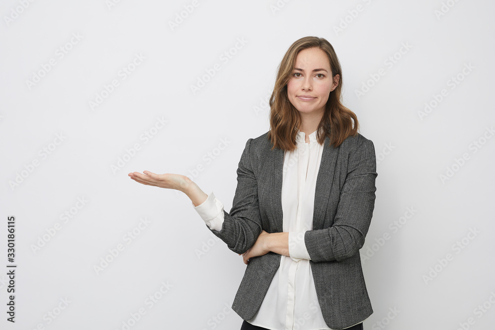 Businesswoman is holding her palm up presenting Businesswoman is holding her palm up presenting