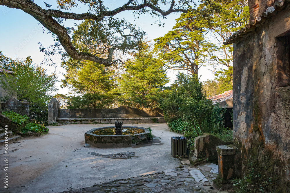 Ancient fountain and stone building. Convent of the Capuchos, Portugal