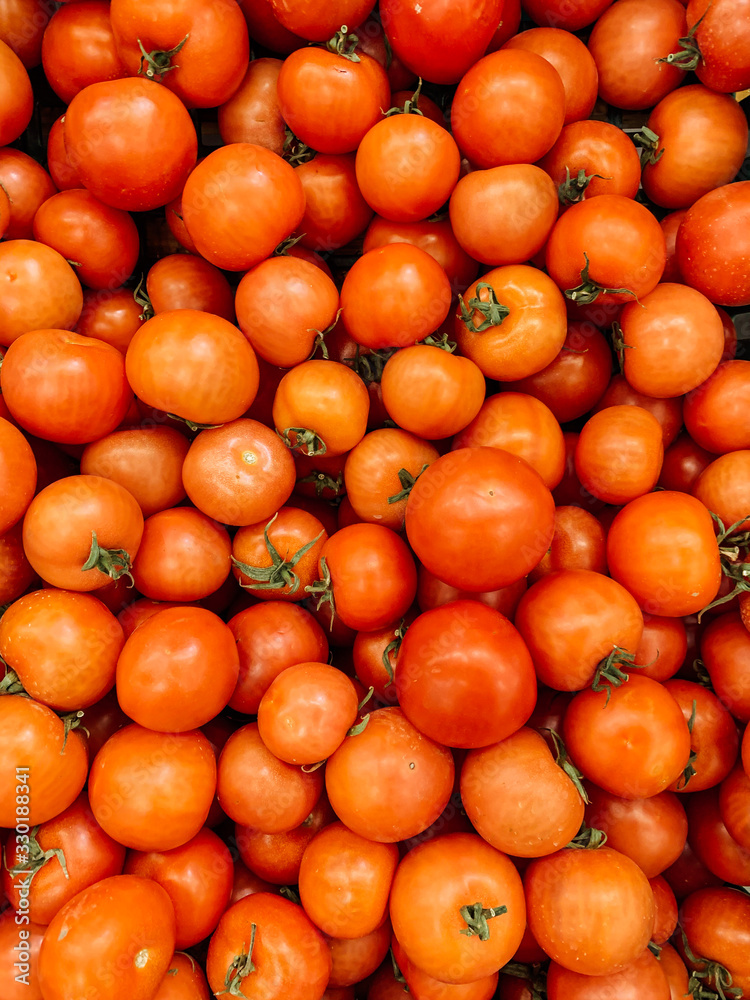 lots of ripe delicious red tomatoes for eating like a background