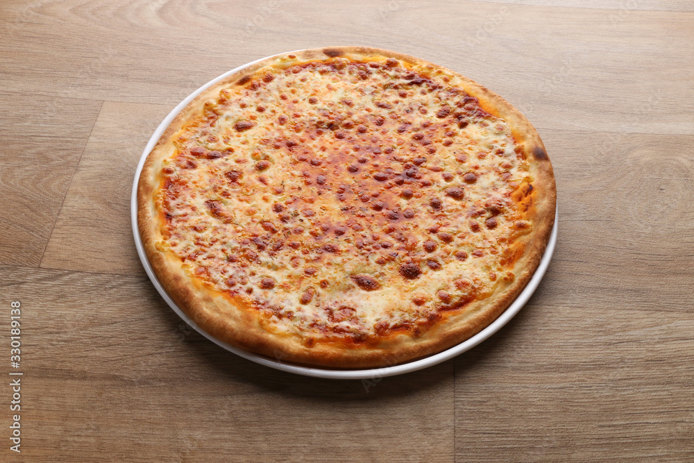 mix cheeses pizza on a wooden background mix cheeses pizza on a wooden background