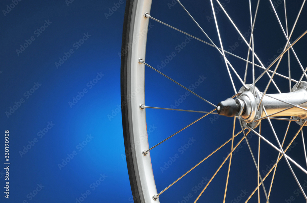 Bicycle Wheel On Blue