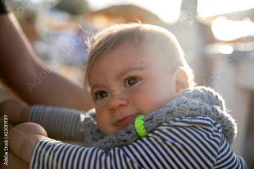 Portrait of cute toddler in strippy top photo