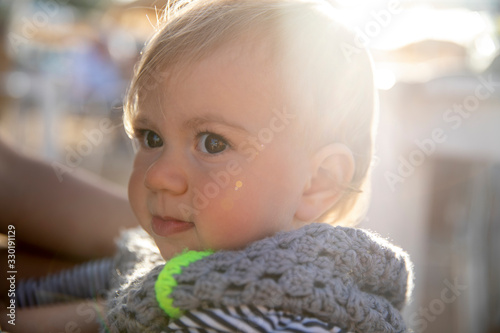 Portrait of cute toddler in strippy top photo