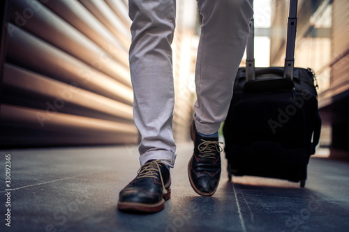 Businessman with suitcase,close up
