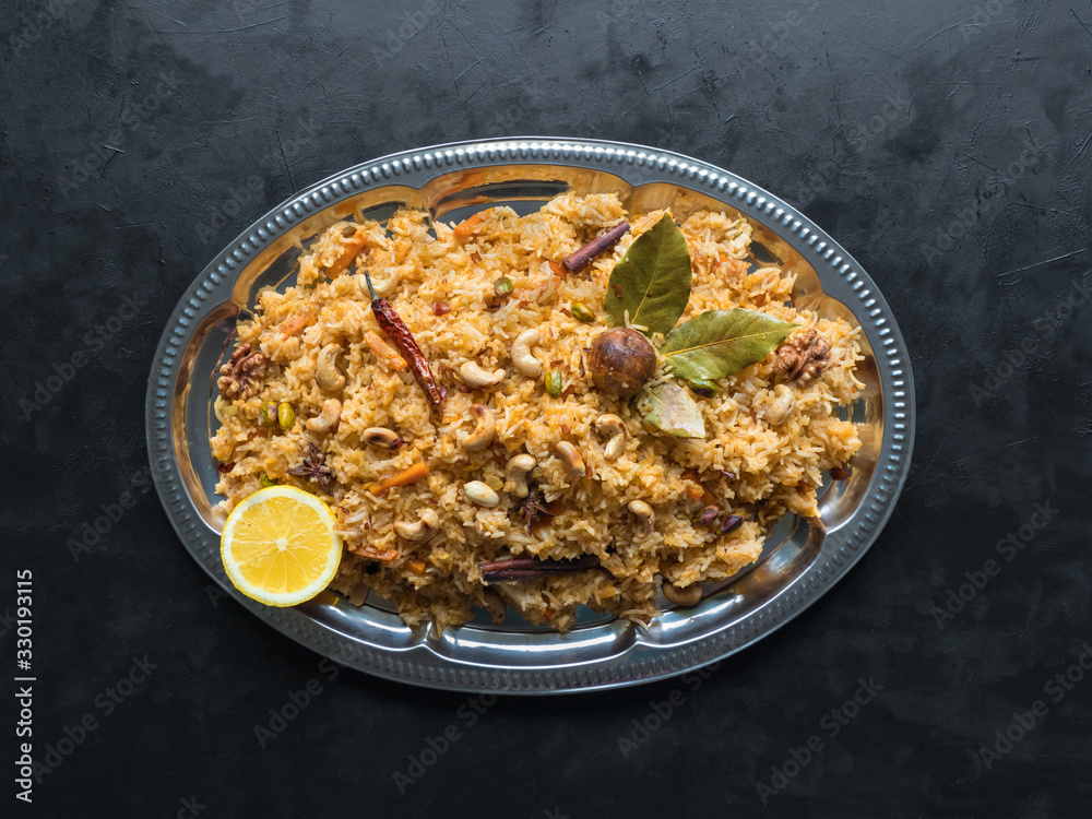Vegetable Biryani, Vegetarian dish on a black table. Top view Vegetable Biryani, Vegetarian dish on a black table. Top view