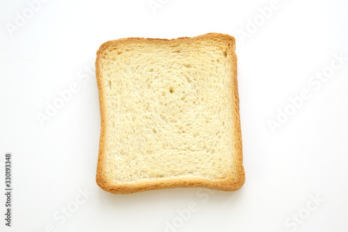 slice of bread crust toast isolated on white background. Copy space. Flat lay. Top view.