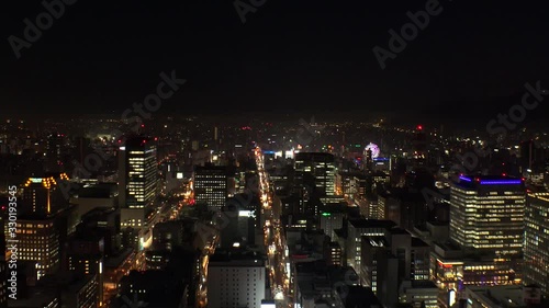 Wallpaper Mural SAPPORO, HOKKAIDO, JAPAN - FEB 2020 : Aerial high angle sunrise view of cityscape of Sapporo city. View of buildings and street traffic around Susukino downtown area. Time lapse shot night to morning. Torontodigital.ca