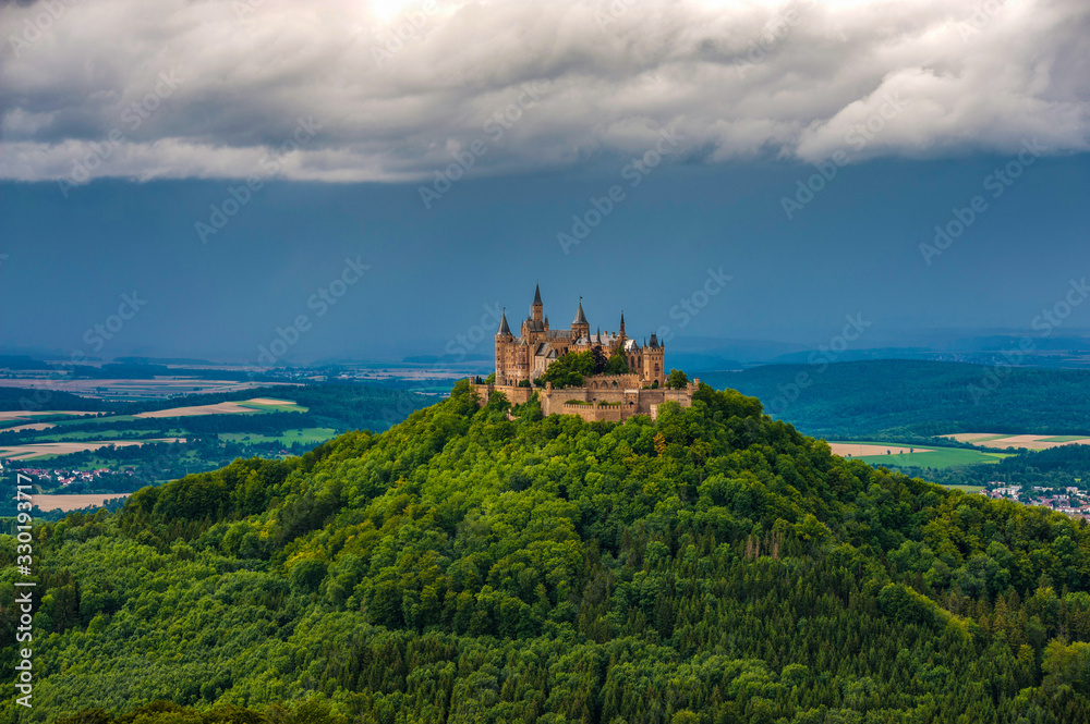 Castle Hohenzollern, seat of the imperial house of Hohenzollern under thick clouds