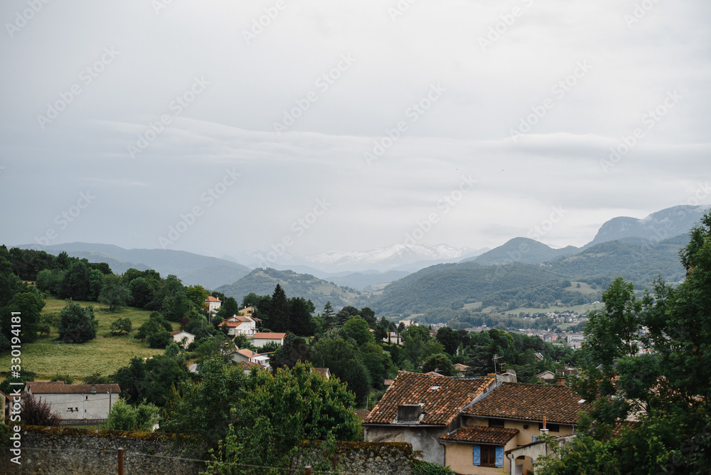 European rural country side highland village view. Photography of houses on the edge of mountain forest and clody sky. European rural country side highland village view. Photography of houses on the edge of mountain forest and clody sky.