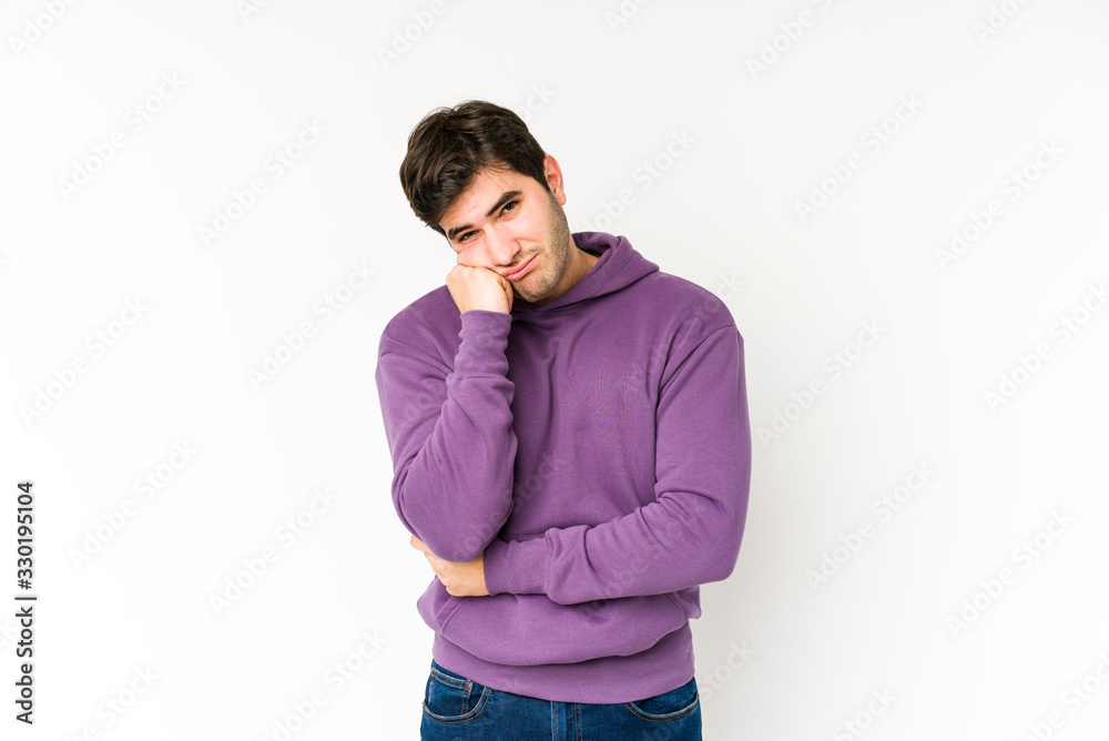 Young man isolated on white background tired of a repetitive task. Young man isolated on white background tired of a repetitive task.