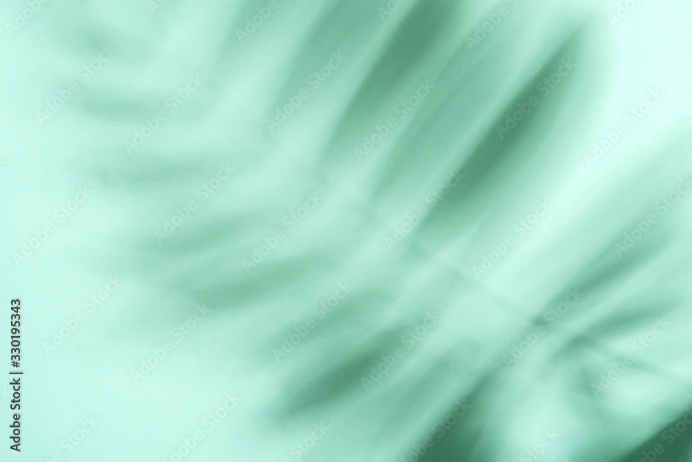Decorative background with shadows from tropical palm plant on a pastel turquoise background. Decorative background with shadows from tropical palm plant on a pastel turquoise background.