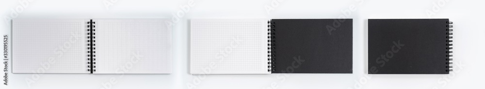 Business concept - Top view collection of black notebook on white background desk for mockup Business concept - Top view collection of black notebook on white background desk for mockup