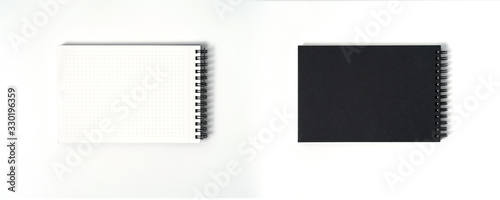 Notebook mock up with clean black blank for design and advertising. Notepad with chromed spring and free copy space template. On the gray background.