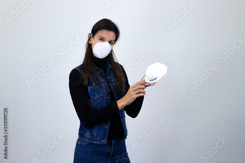 pretty  middle age woman model sell & buy protective medical face masks. Coronavirus, germ, mers-cov, infection, dust, air pollution, viruses, protection, contagious disease, flu epidemic, dust allerg photo