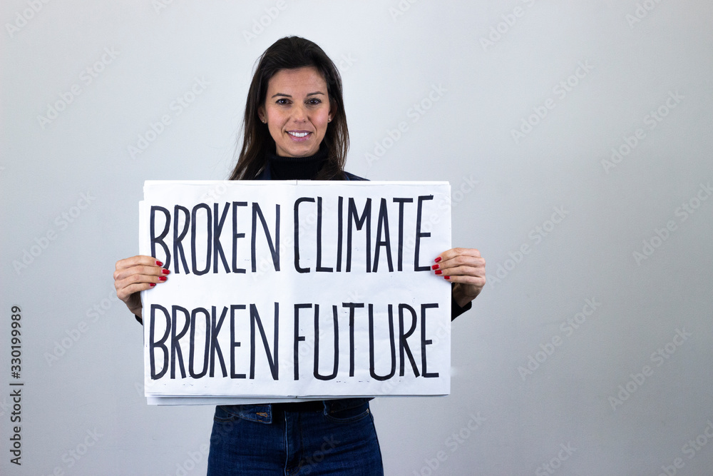 attractive middle age woman activist hold up protesting sign saying attractive middle age woman activist hold up protesting sign saying