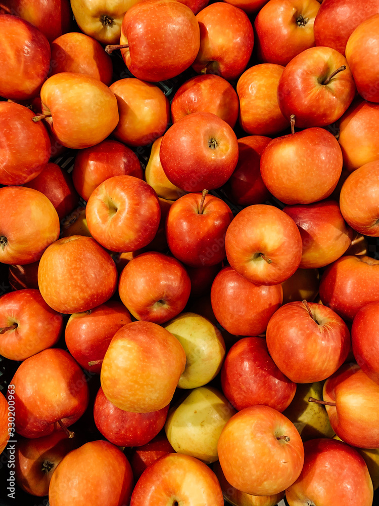 lots of ripe delicious sweet apples to eat like a background