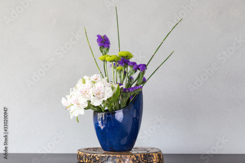 Japanese style flower arrangement Ikebana isolated on white background
