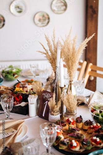 Beautiful wedding table decoration and decor in boho or rustic style photo