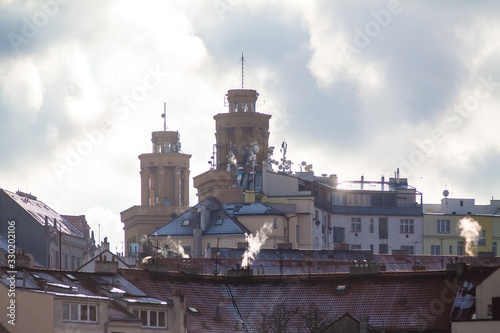 Telephoto of houses of the Zizkov district in Prague, winter day with lovely backlight photo