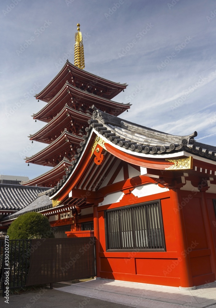 Obraz premium The Five Storied Sensoji or Senso-ji Pagoda, an ancient Buddhist Temple, next to Asakusa Shrine in Tokyo, Japan