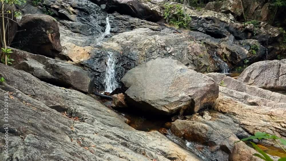 Forest Stream. Waterfall Tropical jungle, wild nature. Beautiful waterfall, wildlife. Tropical palm jungle. Trees and Exotic plants of Asia. Forest Stream. Waterfall Tropical jungle, wild nature. Beautiful waterfall, wildlife. Tropical palm jungle. Trees and Exotic plants of Asia.