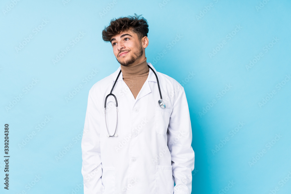 Young arab doctor man idolated dreaming of achieving goals and purposes Young arab doctor man idolated dreaming of achieving goals and purposes