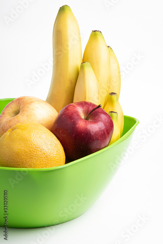Fototapeta Naklejka Na Ścianę i Meble -  A Plastic Bowl Of Fresh Fruits