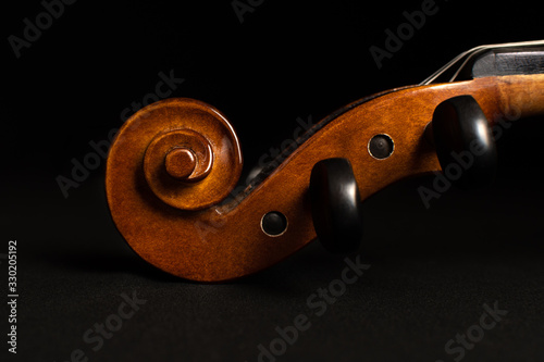 Violin scroll isolated on a black background