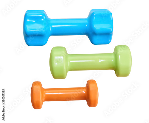 three small dumbbells of different weights isolated on a white background