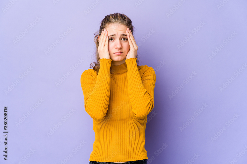 Young caucasian woman on purple background crying, unhappy with something, agony and confusion concept. Young caucasian woman on purple background crying, unhappy with something, agony and confusion concept.