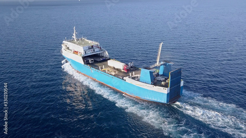 Ro Ro Ship: Aerial view of a medium RoRo Vehicle carrie vessel cruising at sea.