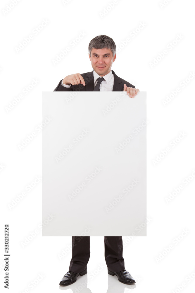 Gray haired businessman holding placard Gray haired businessman holding placard
