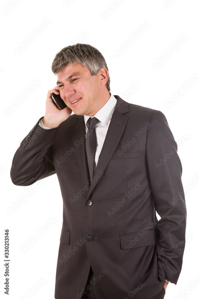 Gray haired businessman on the phone Gray haired businessman on the phone