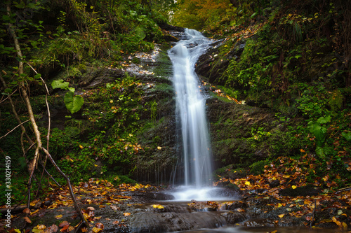 Waterfall in the woods, fresh water spring in the mountains