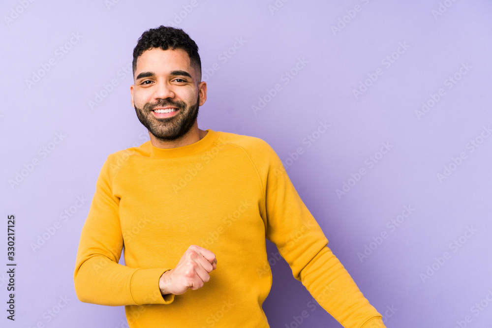 Young mixed race arabic man isolated dancing and having fun. Young mixed race arabic man isolated dancing and having fun.