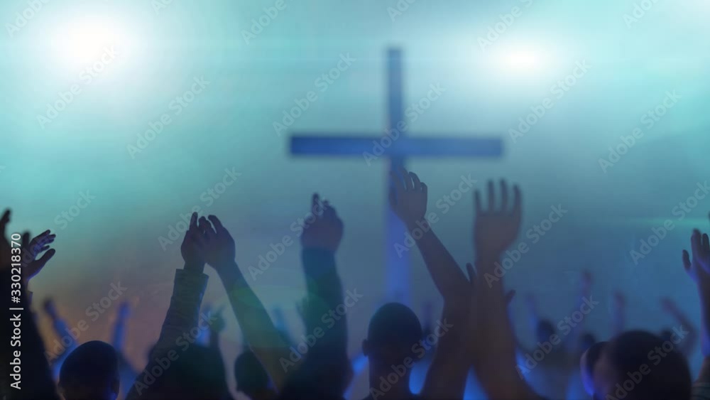 hands of a crowd of people at a Christian meeting during the   glorification praise of God against the background of the cross 3d render