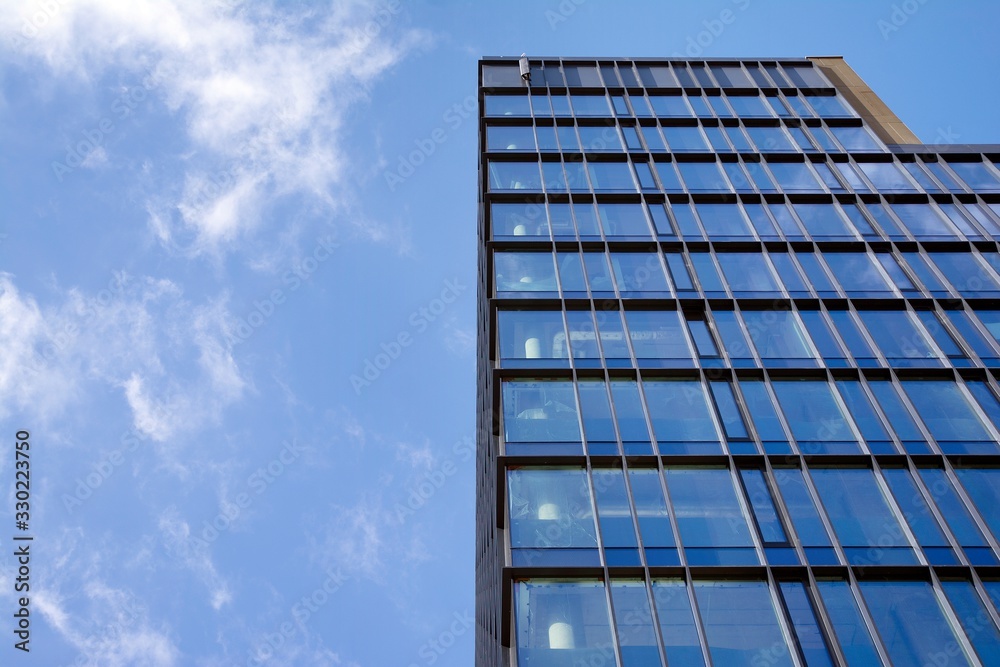 Modern office building facade abstract fragment, shiny windows in steel structure Modern office building facade abstract fragment, shiny windows in steel structure