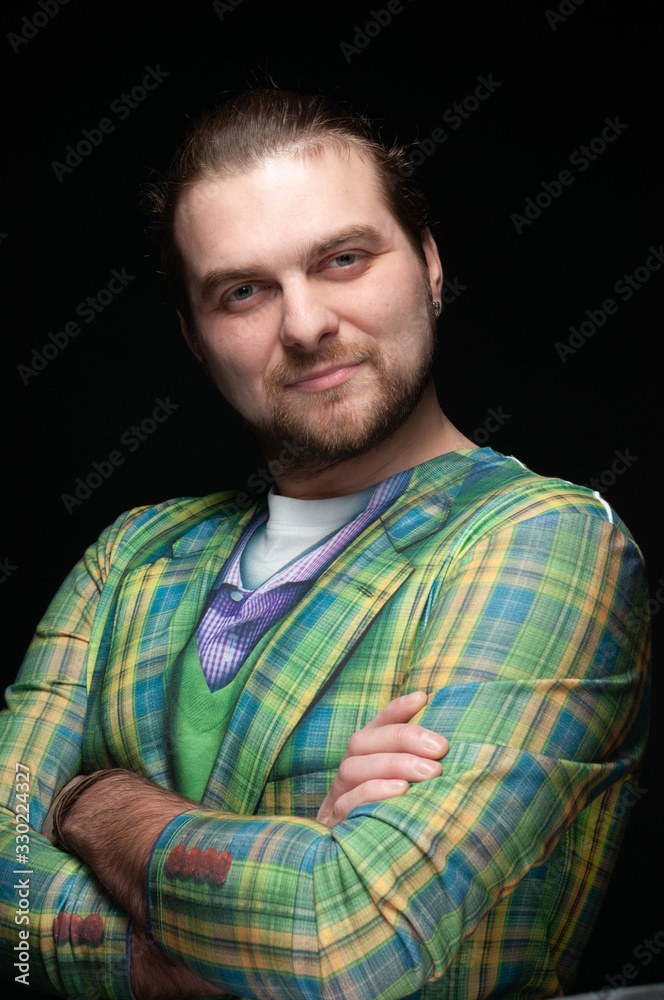 handsome stylish man in green blazer with crossed arms and looking at camera isolated on black handsome stylish man in green blazer with crossed arms and looking at camera isolated on black