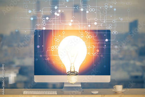Canvastavla Computer on desktop in office with bulb icon hologram