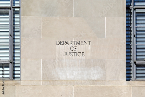 Washington D.C., USA - March 1, 2020: Sign of United States Department of Justice(DOJ) on their headquarters building in Washington, D.C. USA. photo