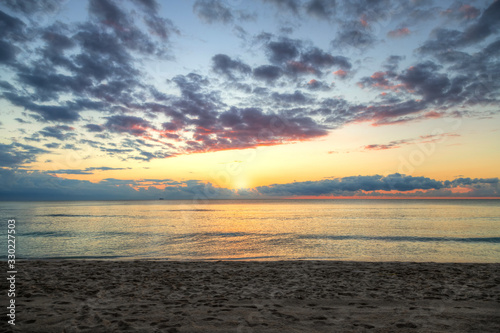 Beautiful Golden Sunrise by the Beach Background © ronniechua