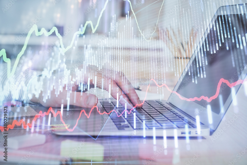 Double exposure of stock market graph with man working on laptop on background. Concept of financial analysis. Double exposure of stock market graph with man working on laptop on background. Concept of financial analysis.