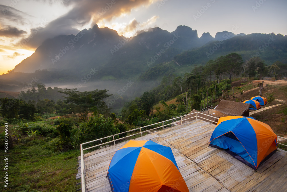 ฺBeautiful morning in the mountains and orange tent at district,Chiang Mai province thailand