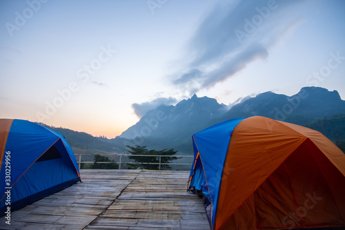ฺBeautiful morning in the mountains and orange tent at district,Chiang Mai province thailand photo