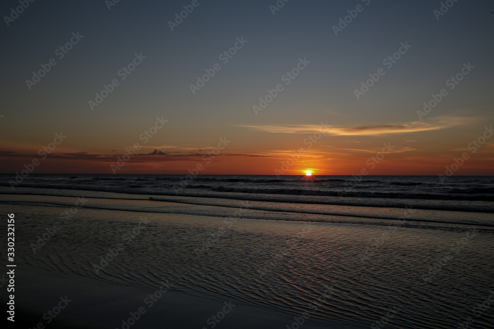 Naklejka premium sunset on the beach