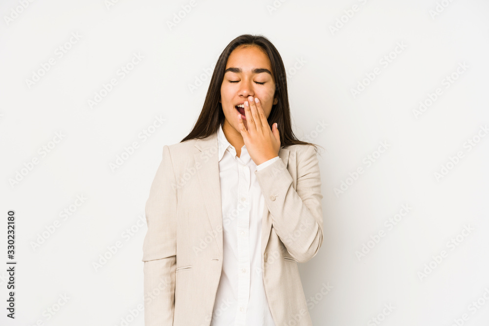 Young woman isolated on a white background yawning showing a tired gesture covering mouth with hand. Young woman isolated on a white background yawning showing a tired gesture covering mouth with hand.